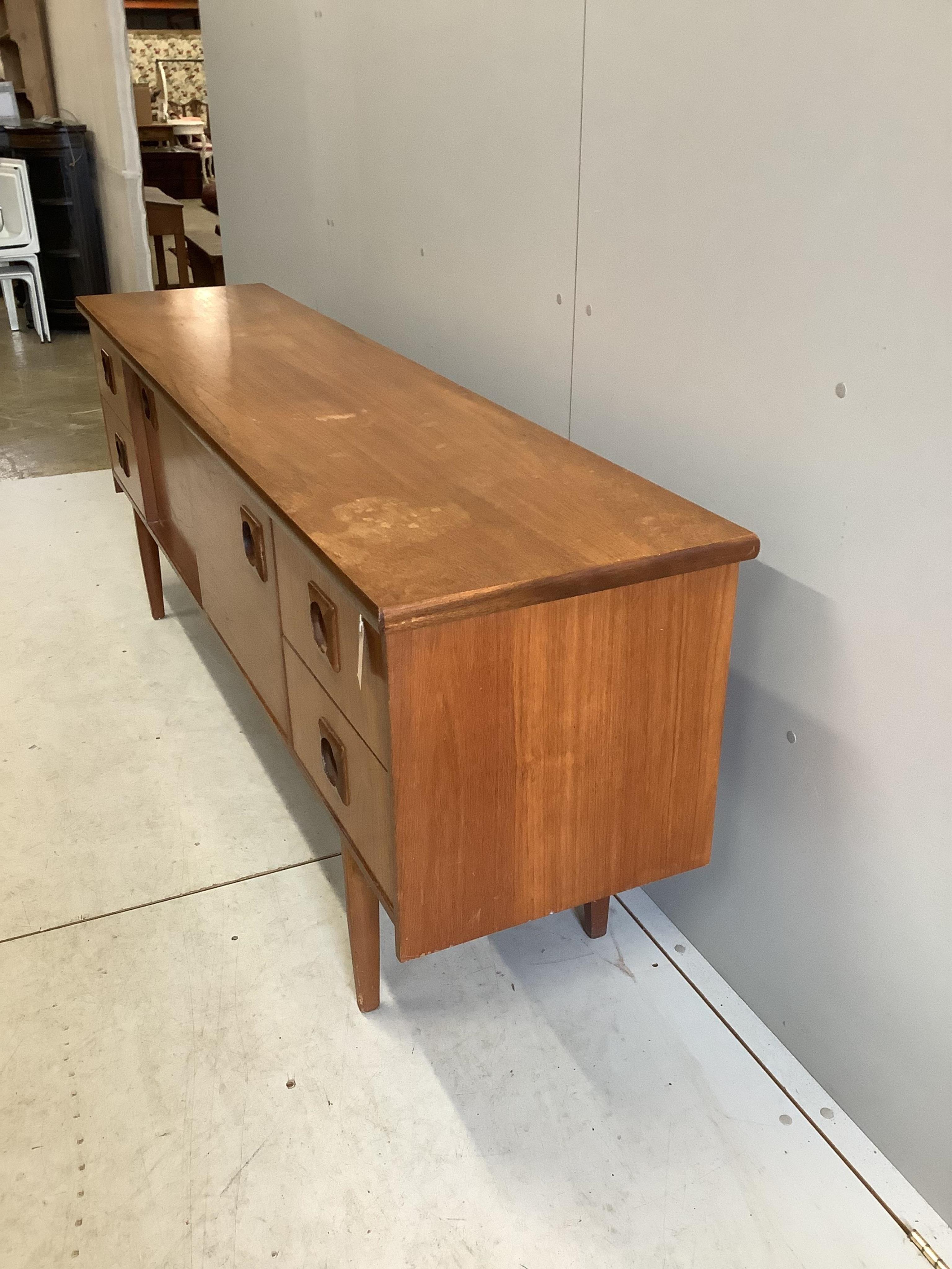 A mid century Bath Cabinet Makers teak sideboard, width 198cm, depth 45cm, height 73cm. Condition - fair